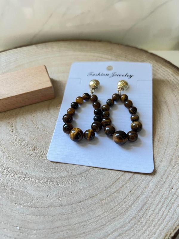 Boucles d oreilles marron et dorees